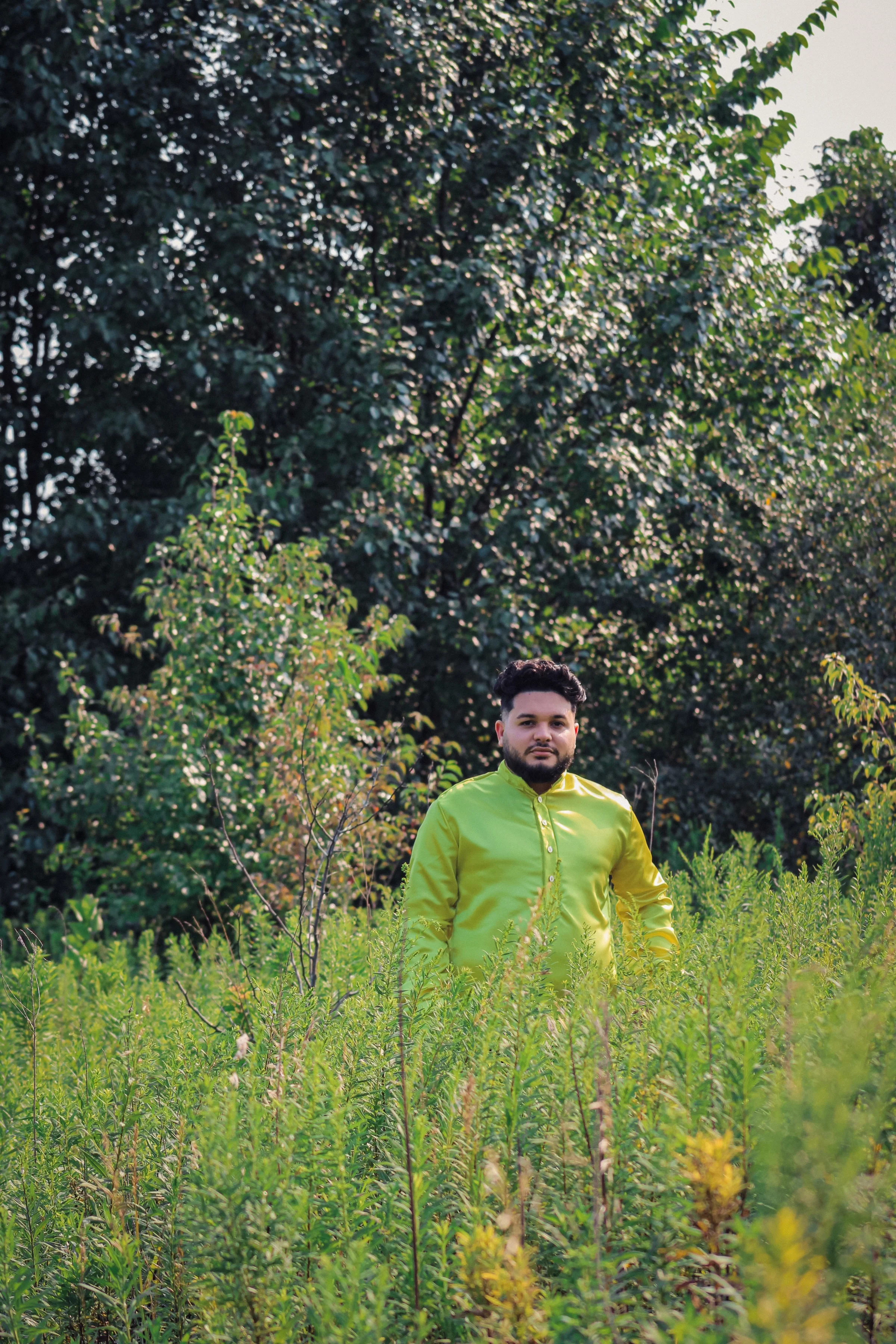 Ethan standing in a green meadow